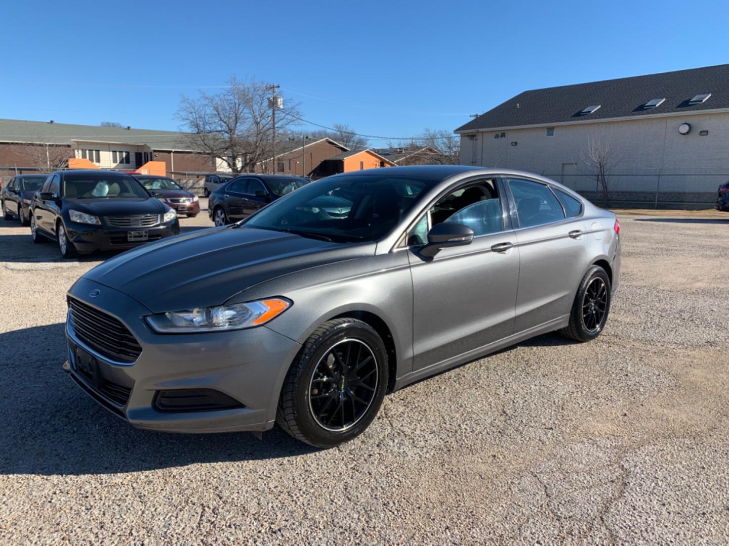 2013 Black /Black Ford Fusion (3FA6P0H79DR) with an 4 Cylinders D 1.5L DI Turbo DOHC 091 CID engine, AUTOMATIC transmission, located at 1830 North Belt Line Road, Irving, TX, 75061, (469) 524-0199, 32.834373, -96.993584 - Photo#4